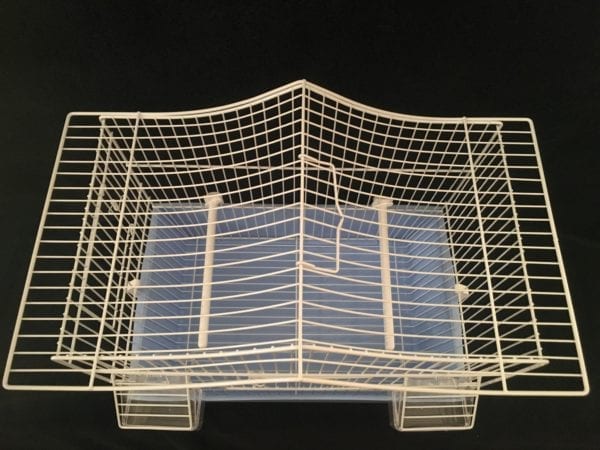 A view of the top of the metal white bird cage with a pitched roof