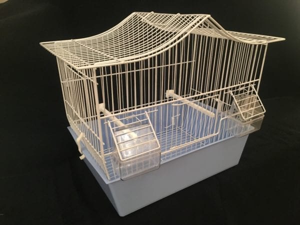 Side View of White metal bird cage, blue plastic tray at bottom with a pitched roof