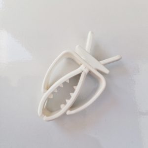 white plastic shark clip