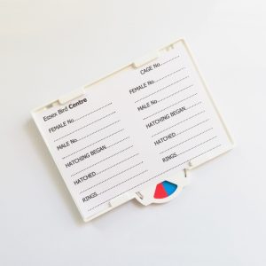 White plastic bird breeding holder with record card and twister dial